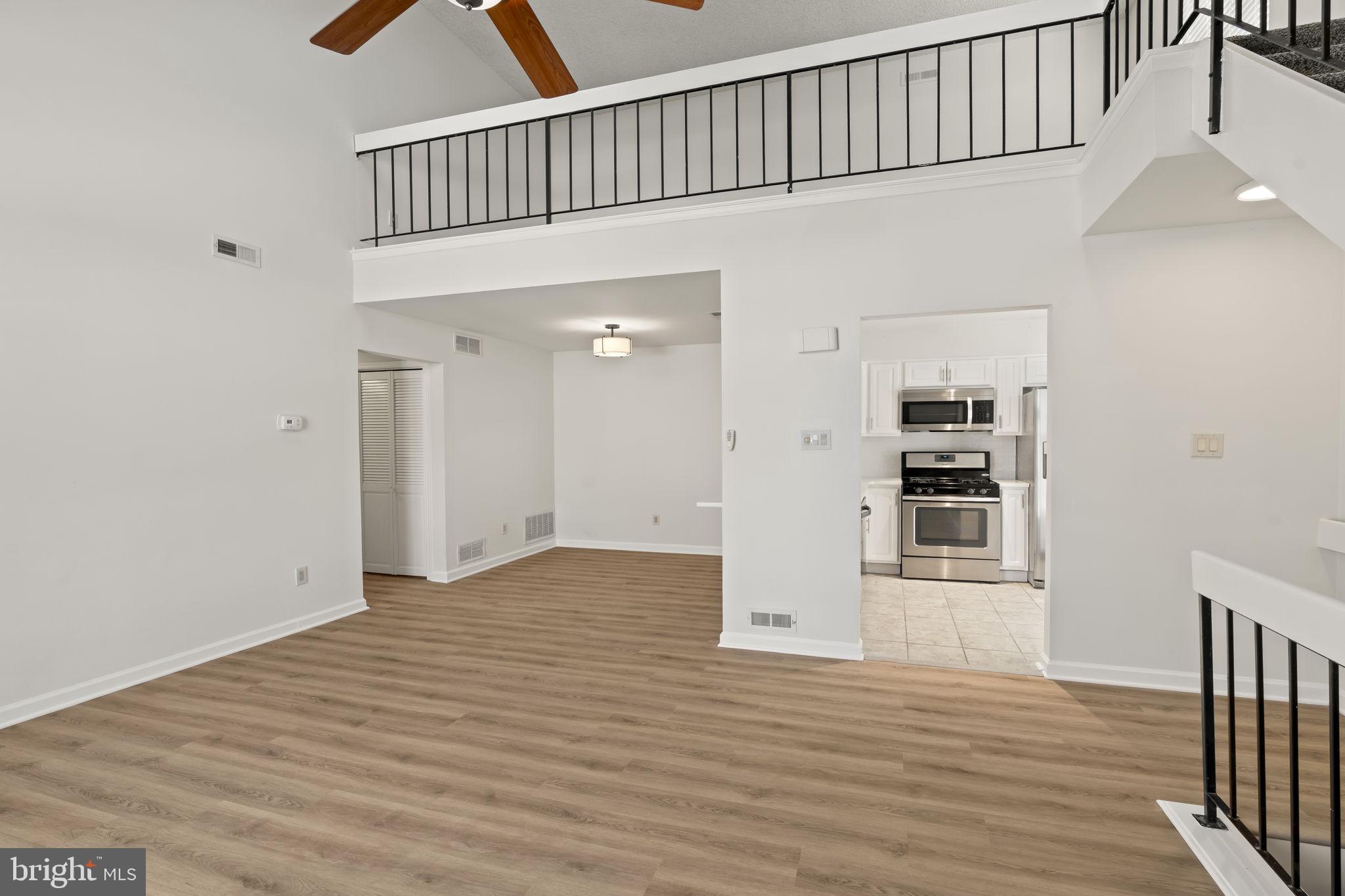5508 B Albridge Way Mount Laurel, NJ 08054 - Photo 5 of 27 a view of an empty room with wooden floor and a window