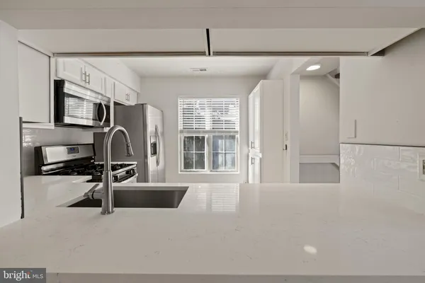 a view of a livingroom with furniture and windows