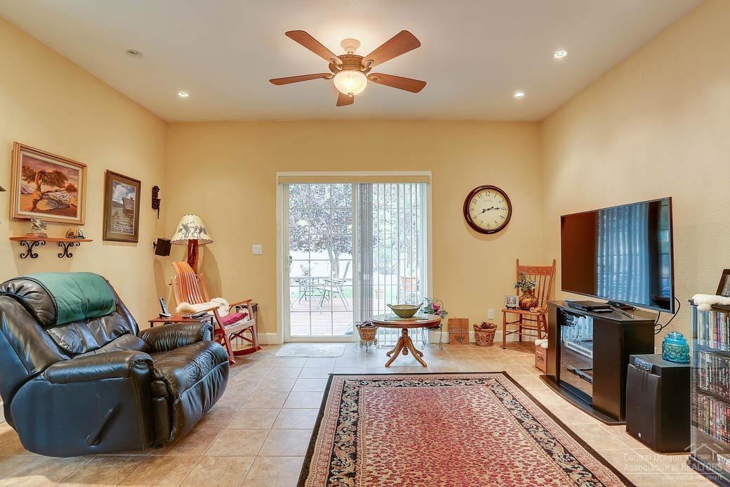 60031 Hopi Road Bend, OR 97702 - Photo 6 of 20 a living room with furniture a rug and a flat screen tv