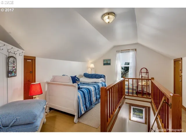 a bedroom with furniture and a window