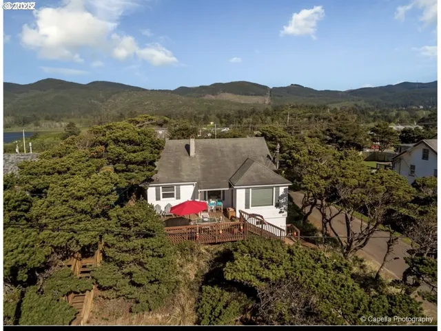 a view of a town with mountains in the background