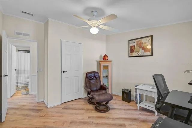 a view of workspace with wooden floor windows