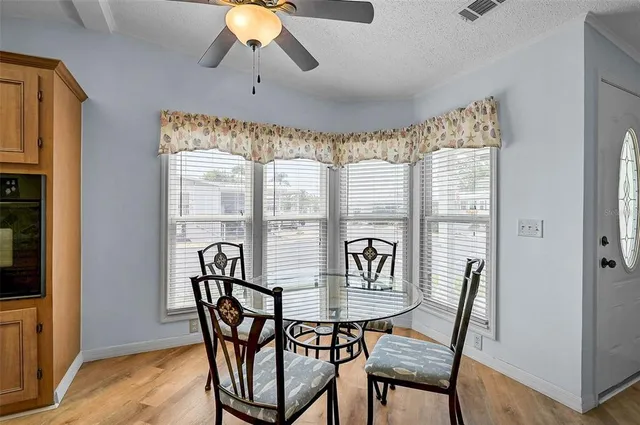 a view of a dining room with furniture window and outside view