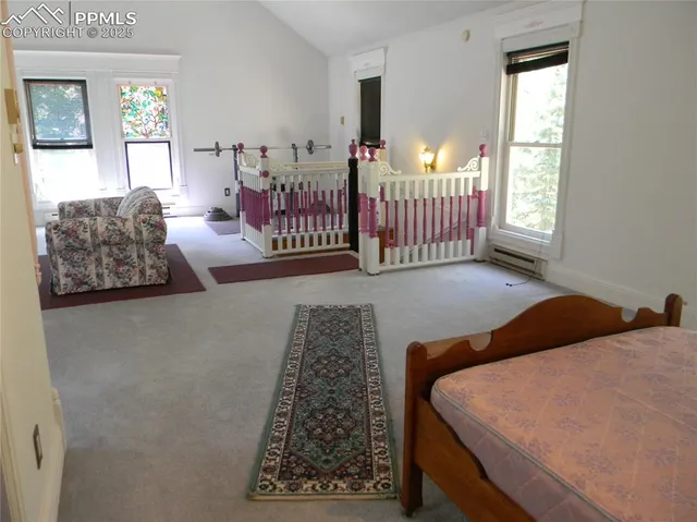 a living room with furniture a large window and a flat screen tv