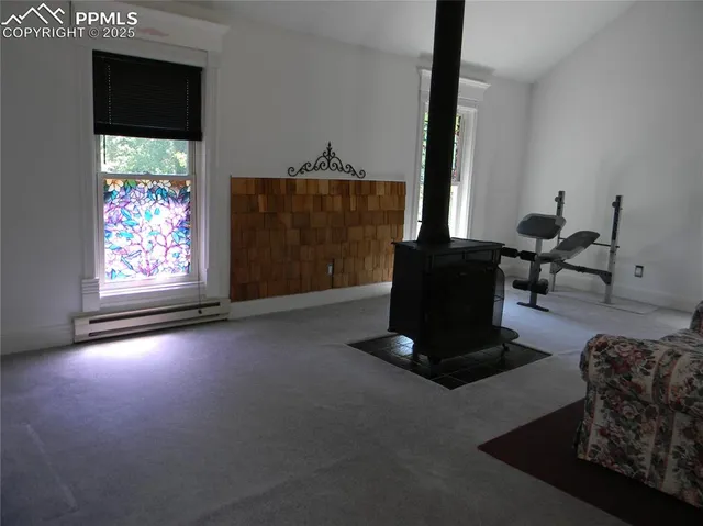 a bedroom with furniture and window