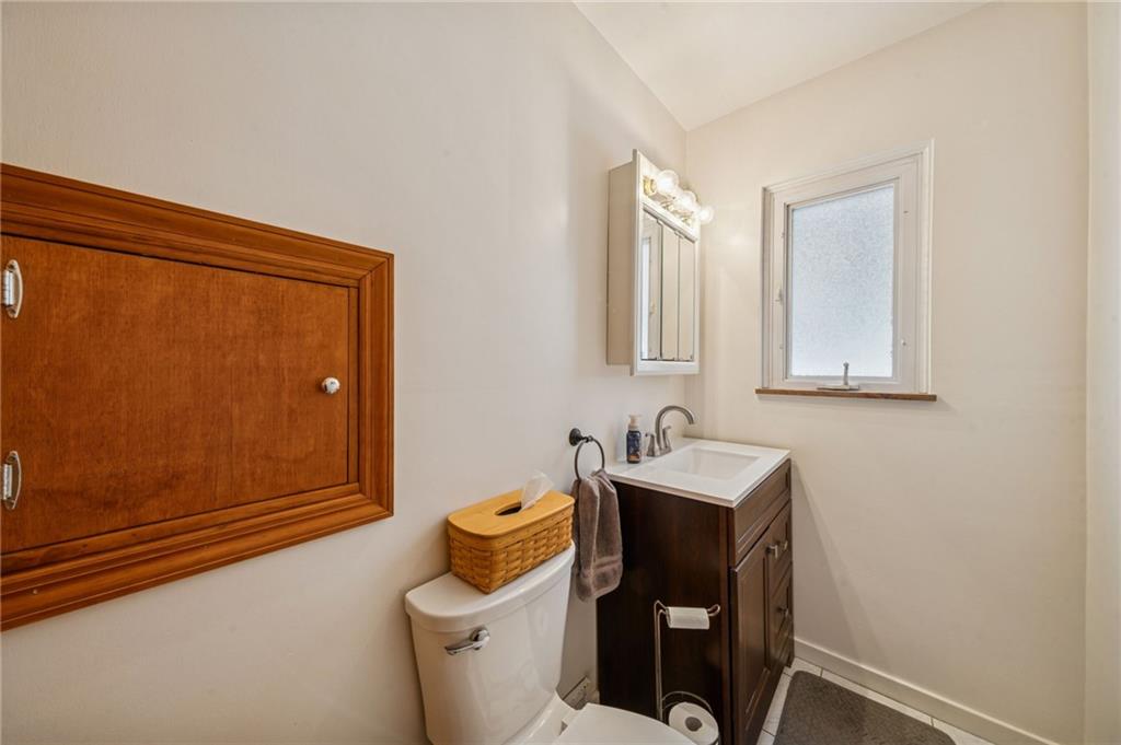 811 5th Street Trafford, PA 15085 - Photo 17 of 36 a bathroom with a sink toilet and mirror