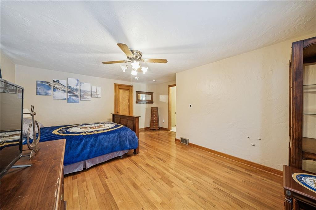 811 5th Street Trafford, PA 15085 - Photo 21 of 36 a living room with a bed furniture and a flat screen tv