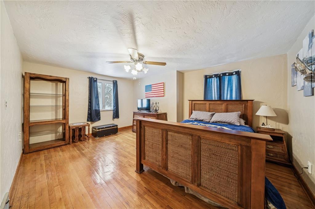 811 5th Street Trafford, PA 15085 - Photo 22 of 36 a living room with furniture and a wooden floor