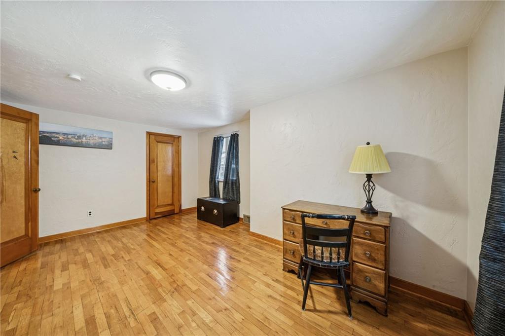 811 5th Street Trafford, PA 15085 - Photo 24 of 36 a view of a workspace with furniture and wooden floor