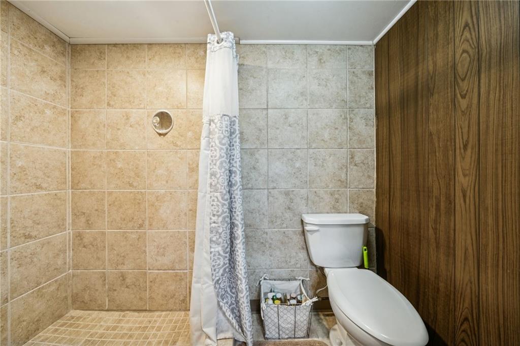 811 5th Street Trafford, PA 15085 - Photo 29 of 36 a white toilet sitting next to a bathroom sink