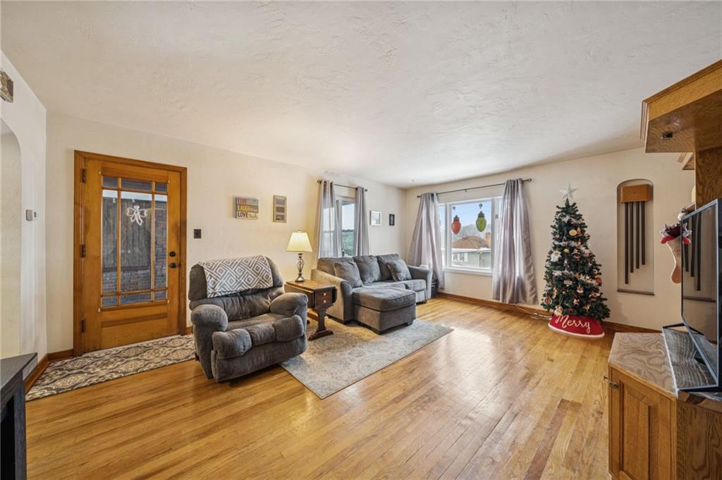 811 5th Street Trafford, PA 15085 - Photo 6 of 36 a living room with furniture and a flat screen tv