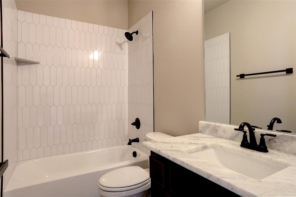 202 Pennington Road Josephine, TX 75173 - Photo 16 of 23 a bathroom with a granite countertop sink toilet and shower