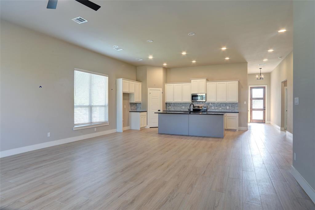 202 Pennington Road Josephine, TX 75173 - Photo 23 of 23 a view of kitchen with wooden floor and window