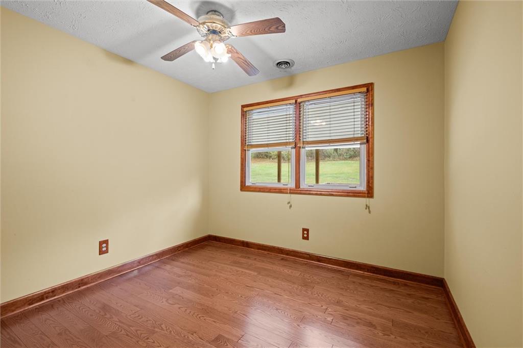 208 Republican Lane Indiana, PA 15701 - Photo 14 of 25 an empty room with a window and ceiling fan