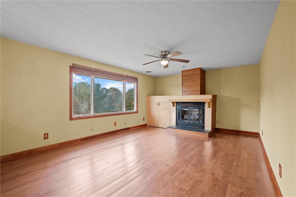 208 Republican Lane Indiana, PA 15701 - Photo 7 of 25 a view of an empty room with a fireplace and a window