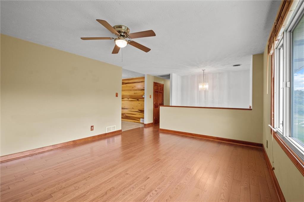 208 Republican Lane Indiana, PA 15701 - Photo 8 of 25 an empty room with wooden floor fan and windows
