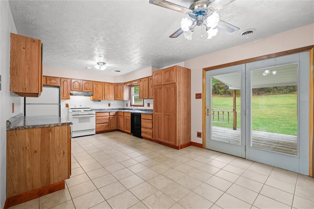 208 Republican Lane Indiana, PA 15701 - Photo 9 of 25 a kitchen with stainless steel appliances granite countertop a refrigerator and a sink