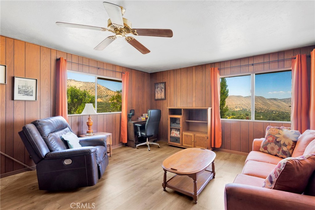5500 Oil Well Road Phelan, CA 92371 - Photo 15 of 65 a living room with furniture and a large window