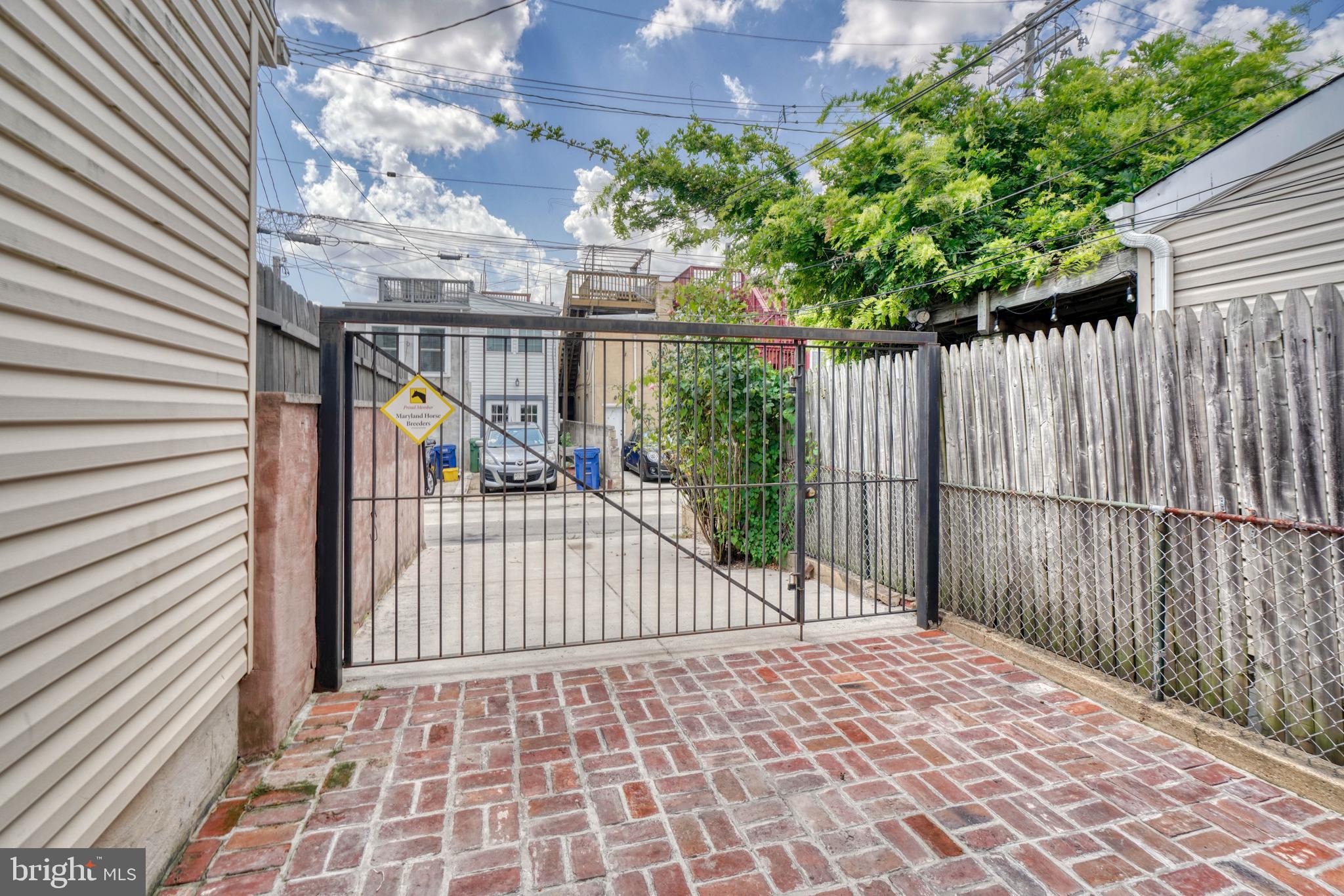 1446 Riverside Avenue Baltimore, MD 21230 - Photo 20 of 60 Fenced brick patio with gate to driveway
