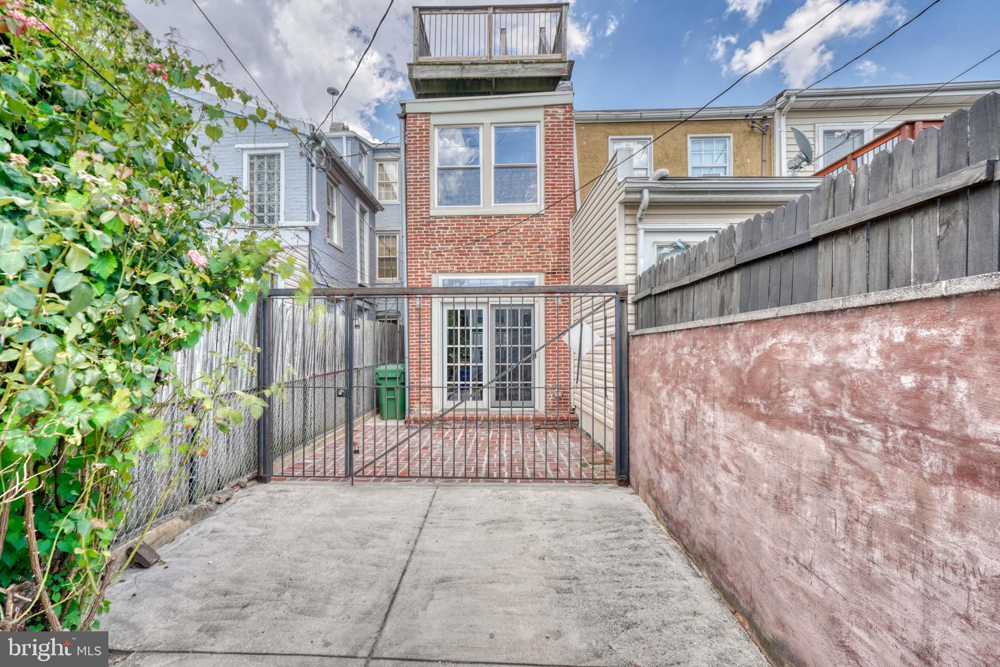 1446 Riverside Avenue Baltimore, MD 21230 - Photo 56 of 60 Driveway and fenced patio