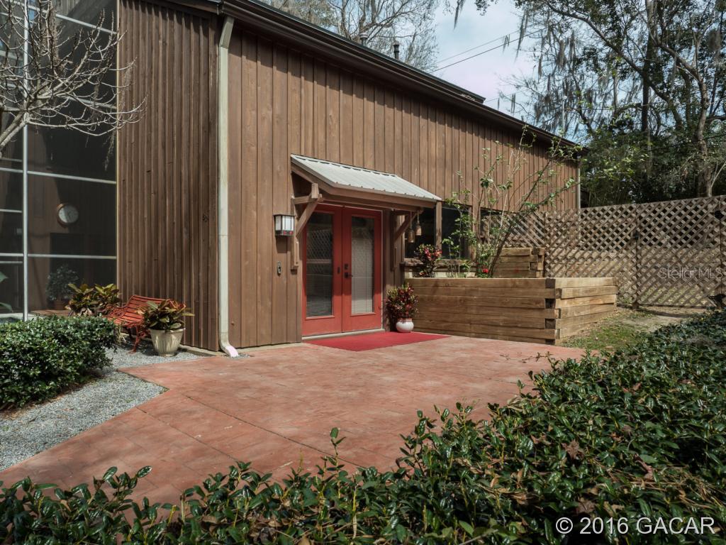 607 Southwest 27th Street Gainesville, FL 32607 - Photo 1 of 1 a view of the house with potted plants