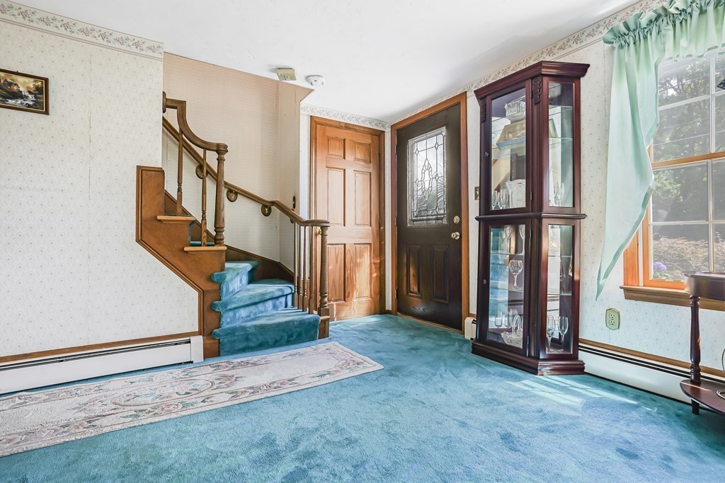 935 Almy Road Somerset, MA 02726 - Photo 11 of 37 a view of entryway with wooden floor and stairs