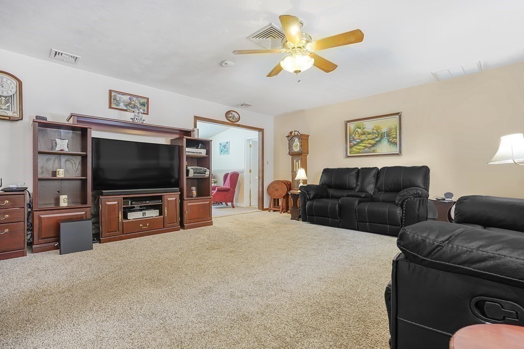 935 Almy Road Somerset, MA 02726 - Photo 17 of 37 a living room with furniture and a flat screen tv