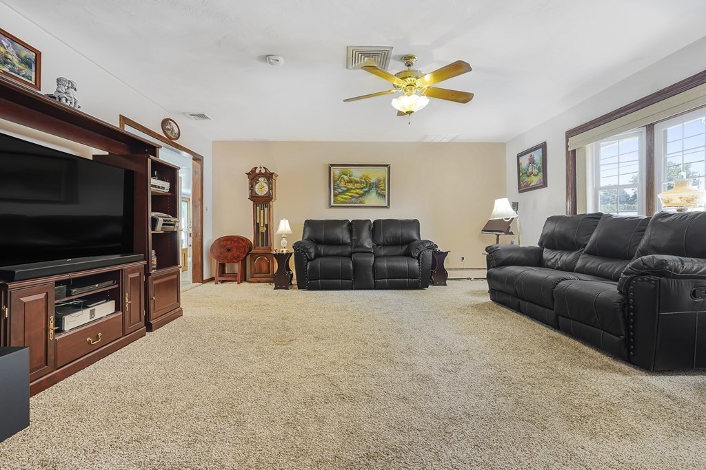 935 Almy Road Somerset, MA 02726 - Photo 18 of 37 a living room with furniture and a flat screen tv