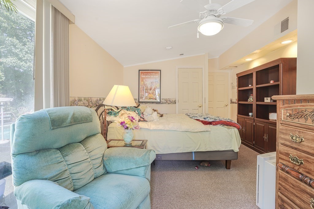 935 Almy Road Somerset, MA 02726 - Photo 26 of 37 a bed room with furniture and a window