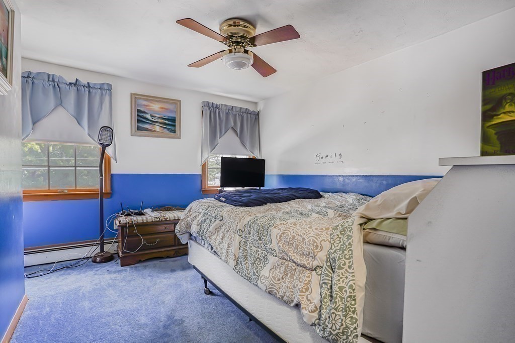 935 Almy Road Somerset, MA 02726 - Photo 31 of 37 a bedroom with a bed and a window