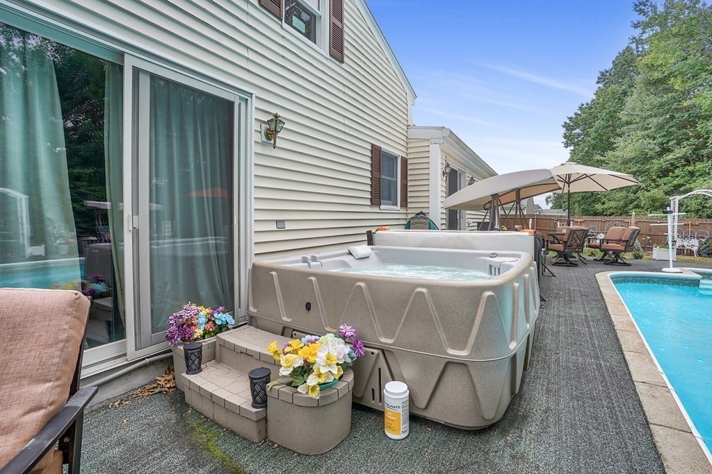 935 Almy Road Somerset, MA 02726 - Photo 9 of 37 a view of a chairs and table in the balcony