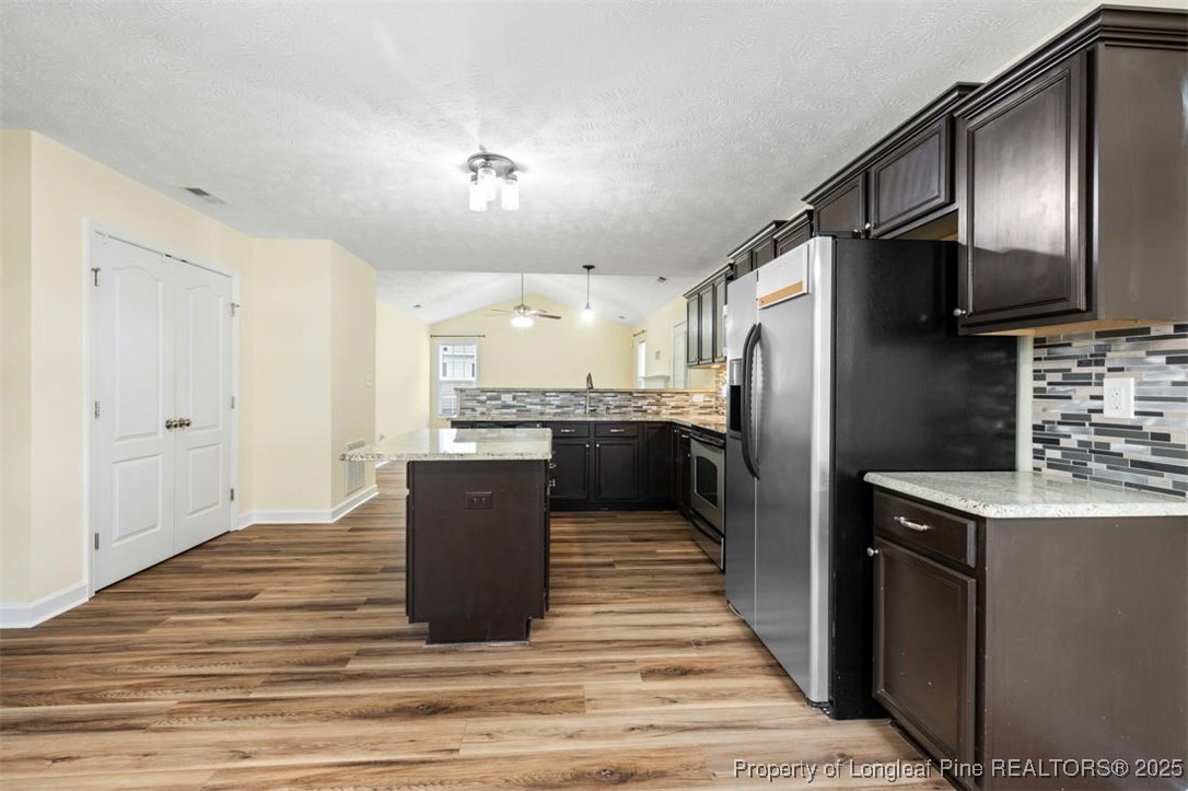 161 Bayleaf Drive Raeford, NC 28376 - Photo 14 of 33 a kitchen with stainless steel appliances granite countertop a refrigerator and a sink