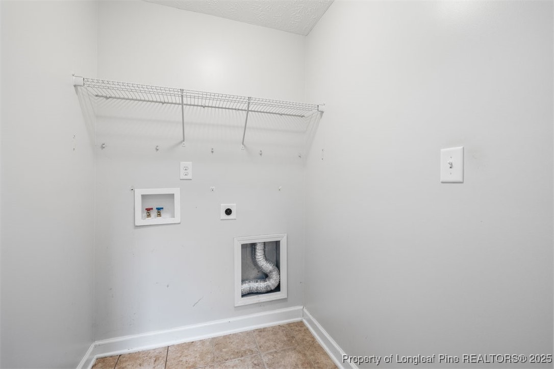 161 Bayleaf Drive Raeford, NC 28376 - Photo 17 of 33 a view of storage and utility room with racks on the wall