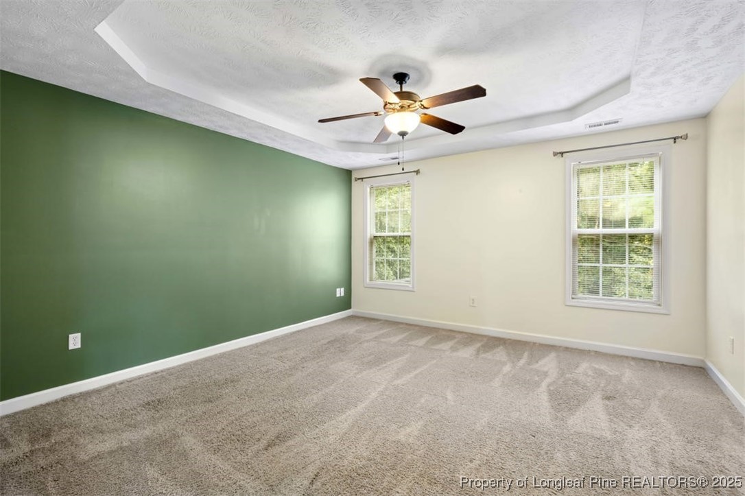 161 Bayleaf Drive Raeford, NC 28376 - Photo 18 of 33 an empty room with windows and fan