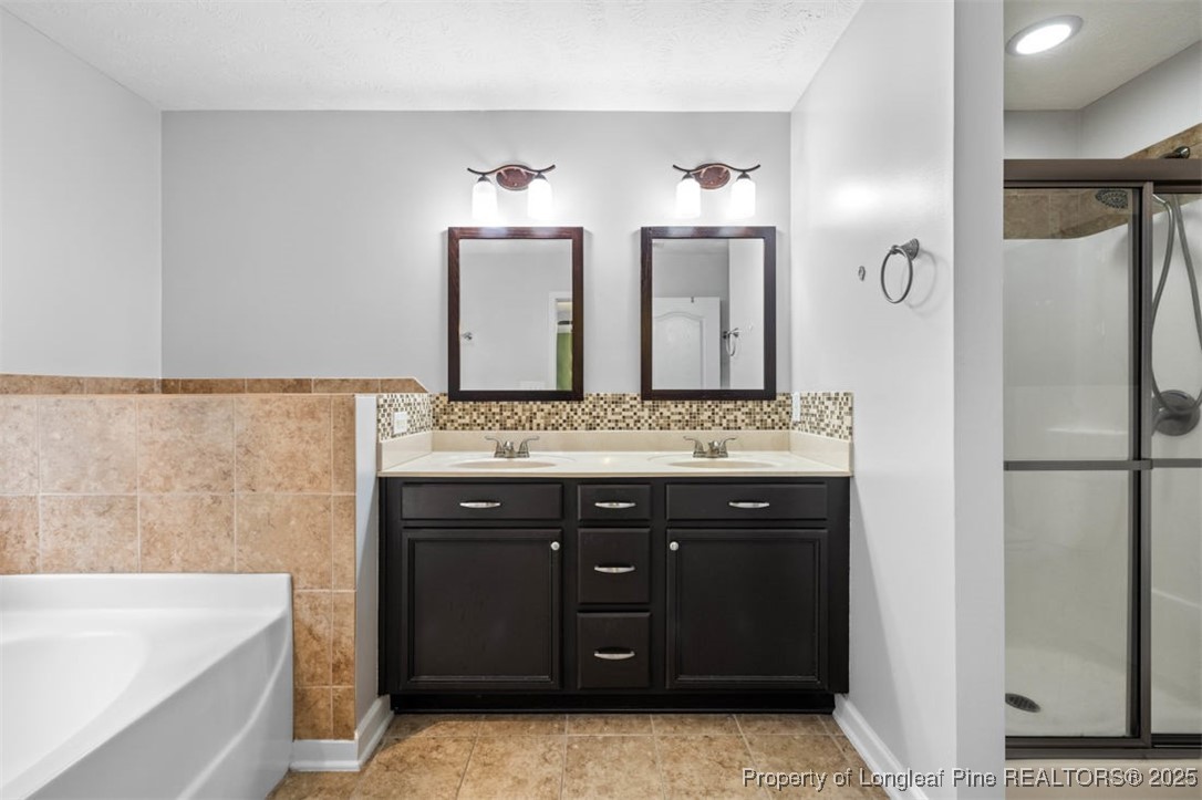 161 Bayleaf Drive Raeford, NC 28376 - Photo 22 of 33 a bathroom with a sink and a mirror