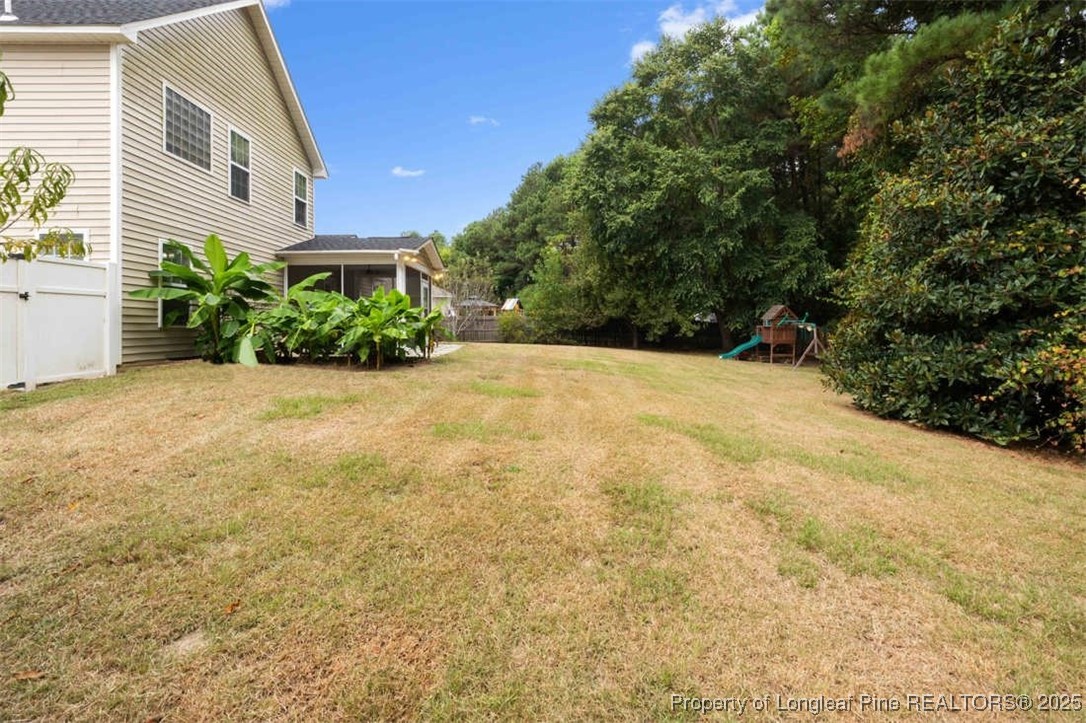 161 Bayleaf Drive Raeford, NC 28376 - Photo 32 of 33 a view of a backyard with plants and large trees