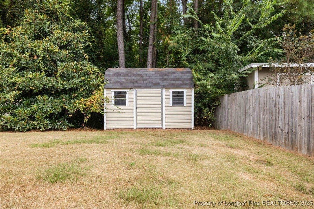 161 Bayleaf Drive Raeford, NC 28376 - Photo 33 of 33 a house with trees in front of it