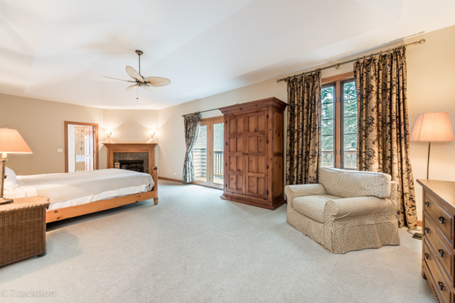 3700 Glendenning Road Downers Grove, IL 60515 - Photo 12 of 25 a spacious bedroom with a bed and glass walk in closet