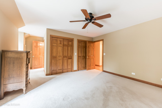 3700 Glendenning Road Downers Grove, IL 60515 - Photo 19 of 25 a view of a livingroom with a ceiling fan and window