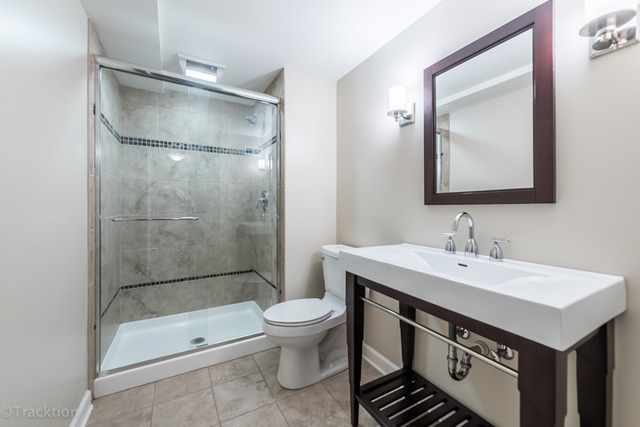 3700 Glendenning Road Downers Grove, IL 60515 - Photo 22 of 25 a bathroom with a sink toilet and shower