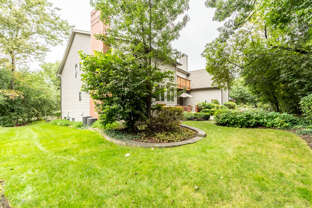 3700 Glendenning Road Downers Grove, IL 60515 - Photo 23 of 25 a backyard of a house with a yard and outdoor seating