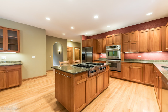 3700 Glendenning Road Downers Grove, IL 60515 - Photo 7 of 25 a kitchen with stainless steel appliances granite countertop a stove a sink dishwasher and a refrigerator