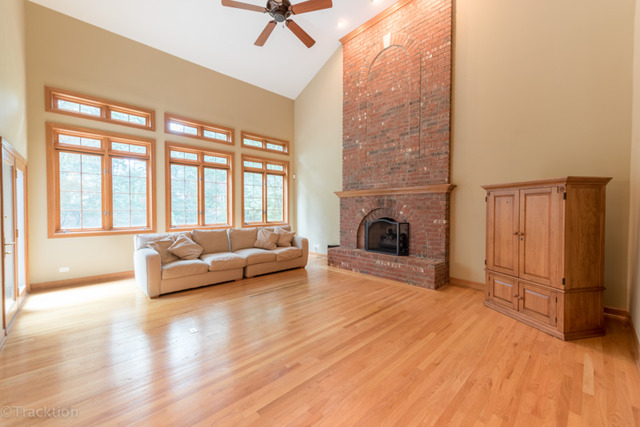 3700 Glendenning Road Downers Grove, IL 60515 - Photo 9 of 25 a living room with furniture and a fireplace