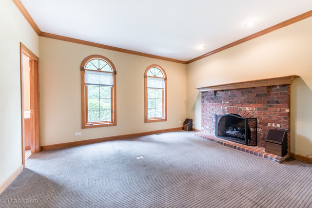 3700 Glendenning Road Downers Grove, IL 60515 - Photo 10 of 25 a view of a livingroom with a fireplace and window