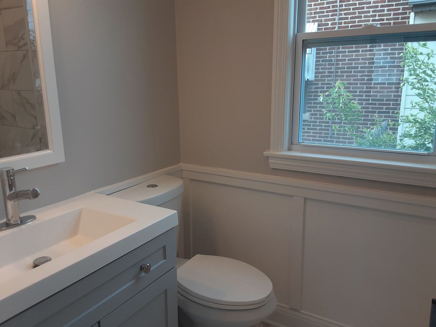 1417 Lee Boulevard Berkeley, IL 60163 - Photo 13 of 24 a bathroom with a sink a toilet and a window