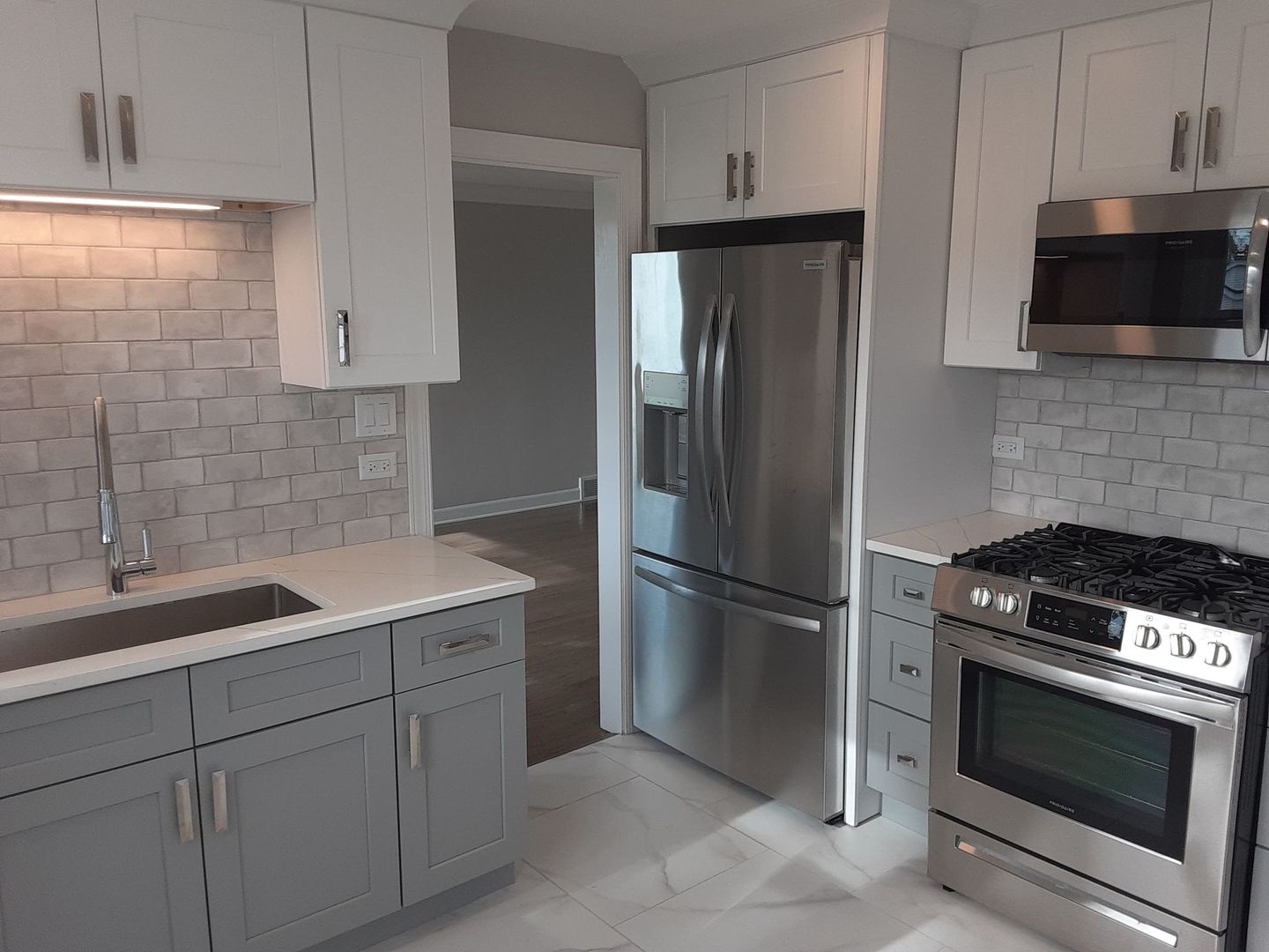 1417 Lee Boulevard Berkeley, IL 60163 - Photo 4 of 24 a kitchen with a refrigerator stove and sink