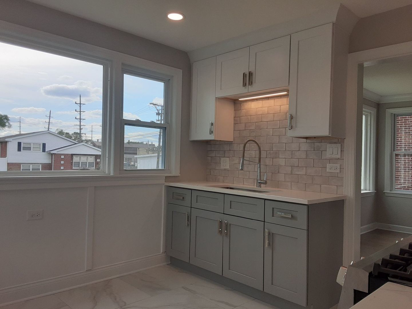 1417 Lee Boulevard Berkeley, IL 60163 - Photo 6 of 24 a kitchen with sink and cabinets