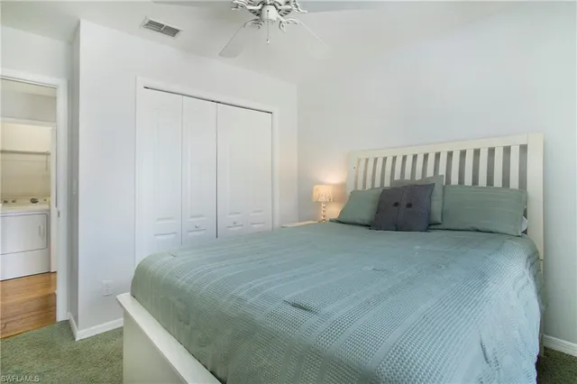 a bedroom with a bed and a table