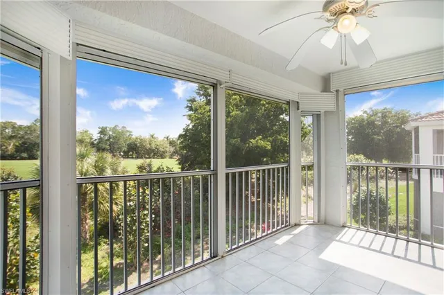a view of a porch with a floor to ceiling window