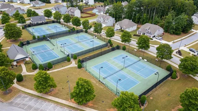 an aerial view of a residential houses with outdoor space